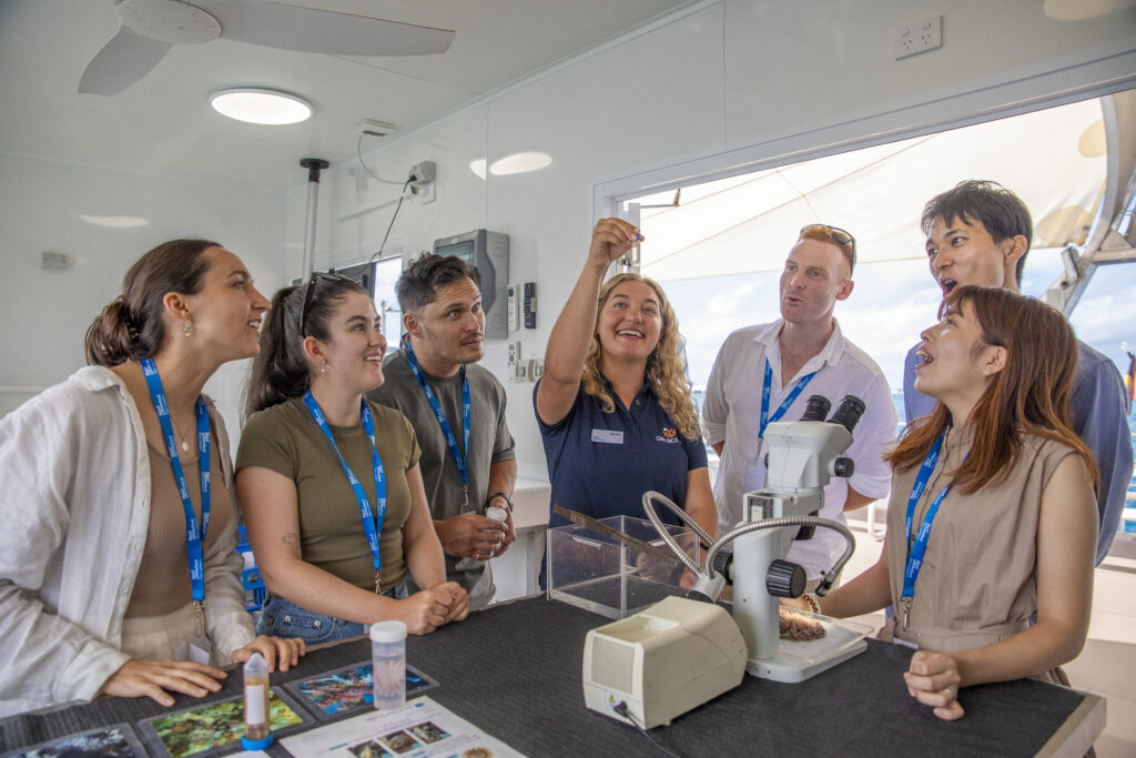 Delegates taking part in reef conversation experience